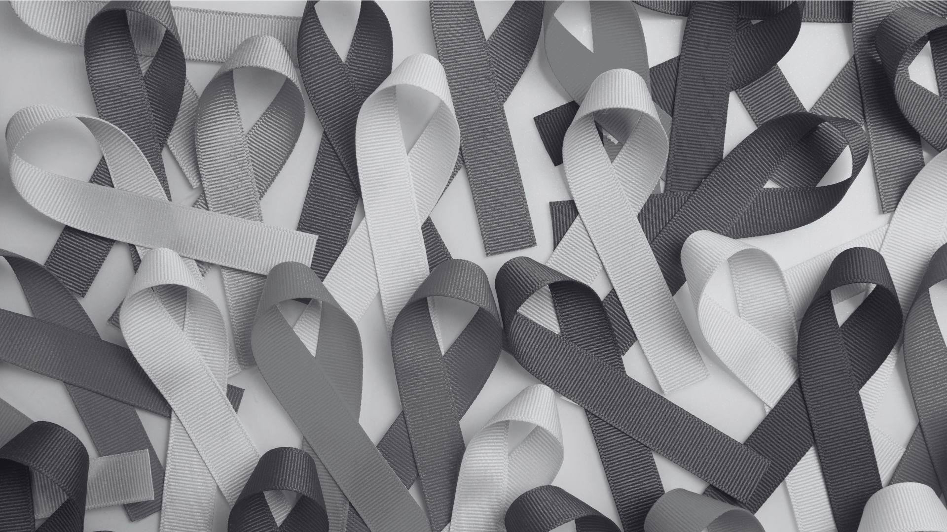 Cancer ribbons spread out on a table